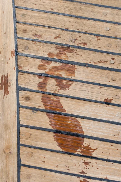 Footprint on the wooden deck — Stock Photo, Image