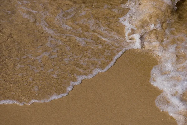 Onda suave en la playa de arena — Foto de Stock