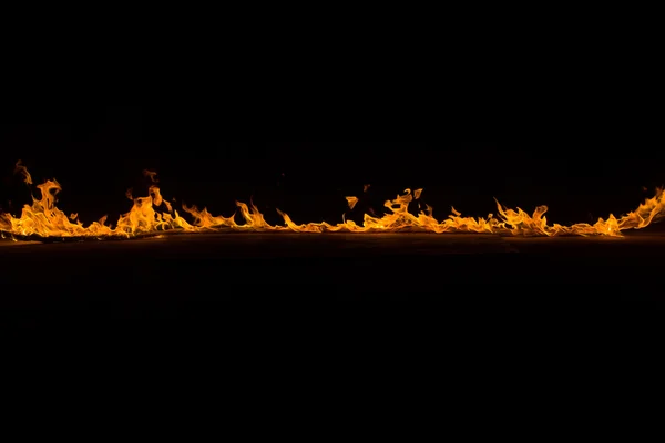 Blazing flames on black background — Stock Photo, Image