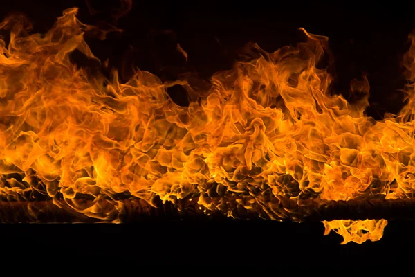 Blazing flames on black background — Stock Photo, Image