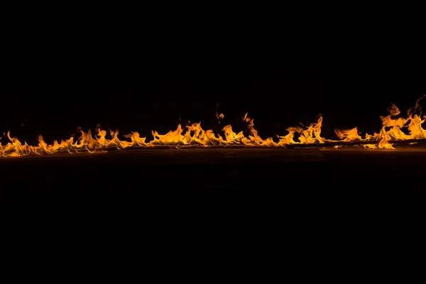 Blazing flames on black background — Stock Photo, Image