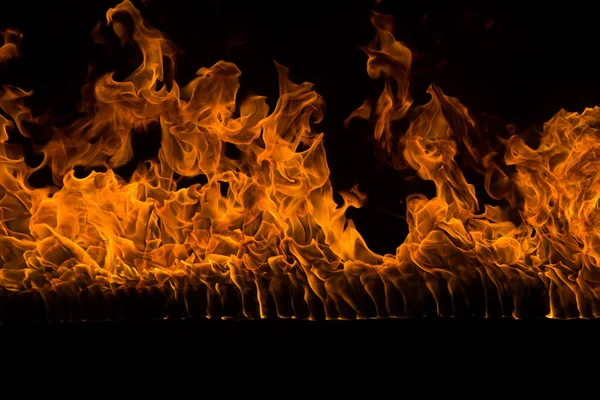 Blazing flames on black background — Stock Photo, Image