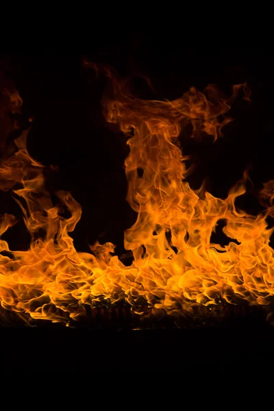 Blazing flames on black background — Stock Photo, Image