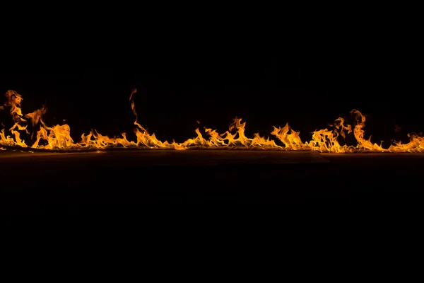 Blazing flames on black background — Stock Photo, Image