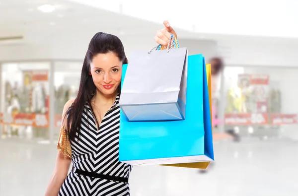 Young woman holding shopping bags — Stock Photo, Image