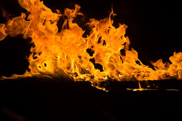 Blazing flames on black background — Stock Photo, Image