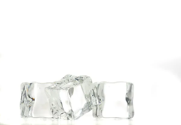 Ice cubes over white background. — Stock Photo, Image