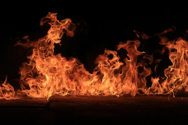 Blazing flames on black background — Stock Photo, Image