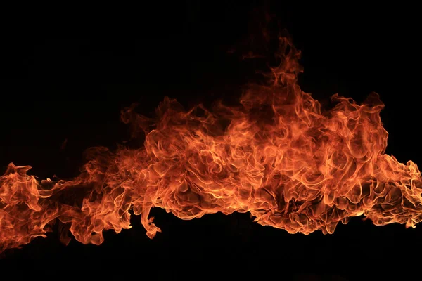 Blazing flames on black background — Stock Photo, Image