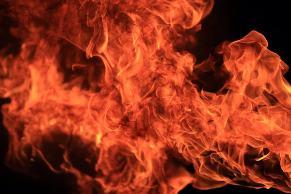 Blazing flames on black background — Stock Photo, Image