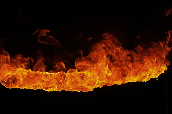 Blazing flames on black background — Stock Photo, Image