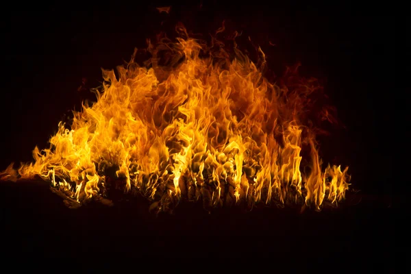 Blazing flames on black background — Stock Photo, Image