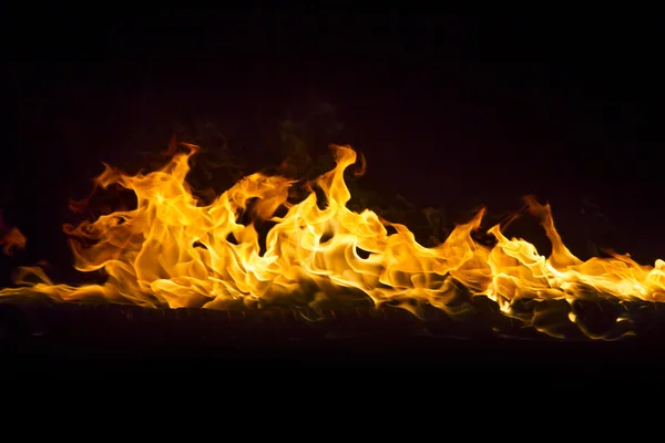 Blazing flames on black background — Stock Photo, Image