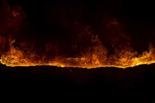 Blazing flames on black background — Stock Photo, Image