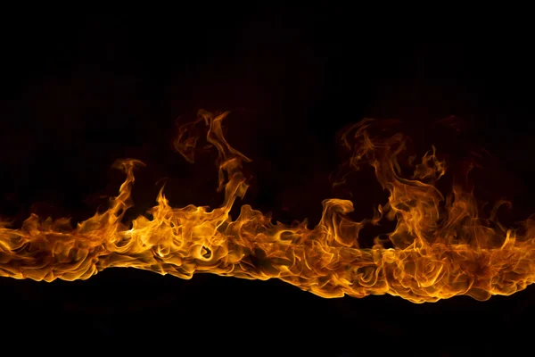 Blazing flames on black background — Stock Photo, Image