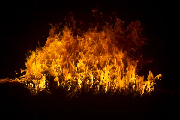 Blazing flames on black background — Stock Photo, Image