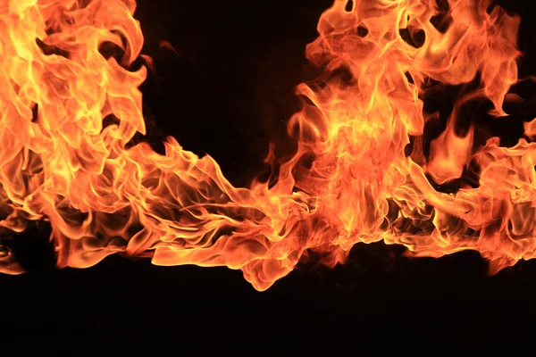 Blazing flames on black background — Stock Photo, Image