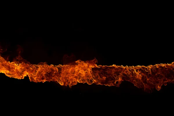 Blazing flames on black background — Stock Photo, Image