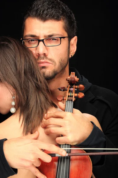 Beautiful sensual couple with violin — Stock Photo, Image