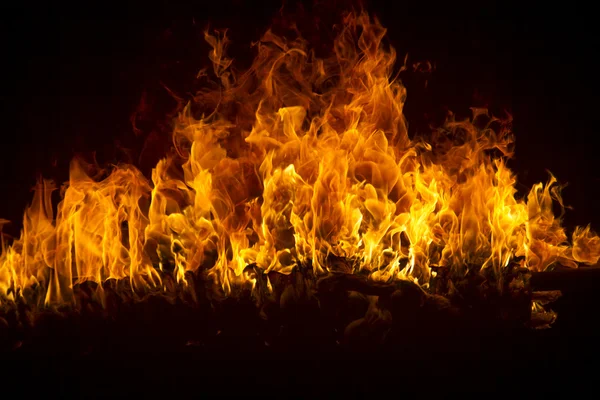 Blazing flames on black background — Stock Photo, Image