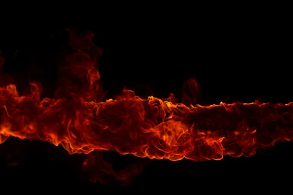 Blazing flames on black background — Stock Photo, Image