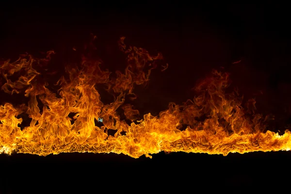 Blazing flames on black background — Stock Photo, Image