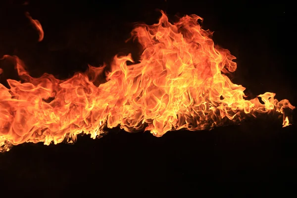 Blazing flames on black background — Stock Photo, Image