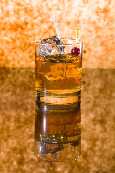 Whisky liqueur glass with ice cubes — Stock Photo, Image