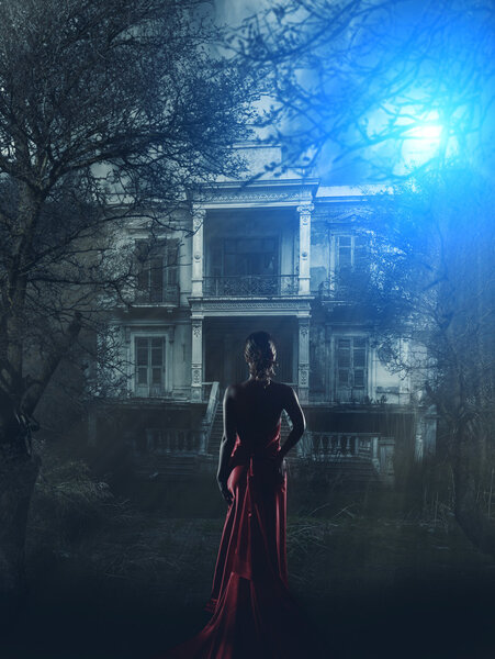 Woman in red dress at haunted house