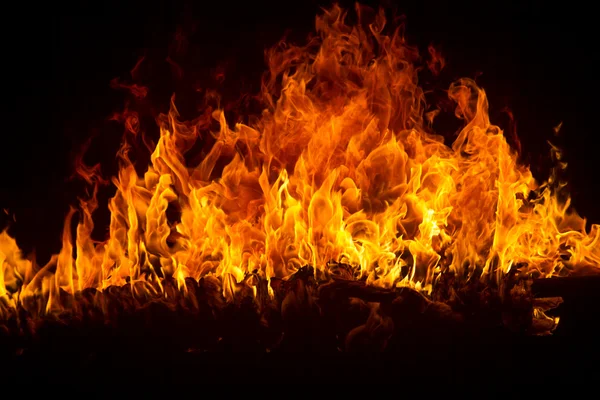 Blazing flames on black background — Stock Photo, Image