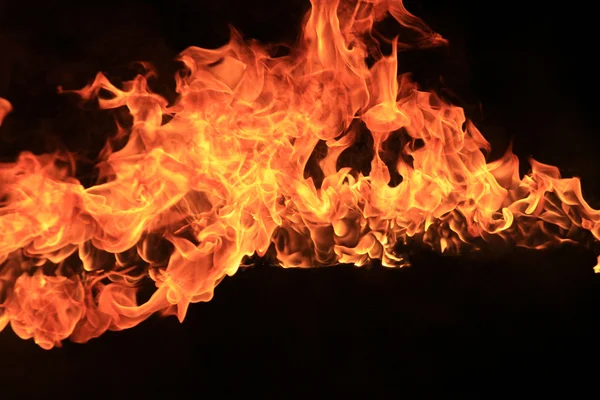 Blazing flames on black background — Stock Photo, Image