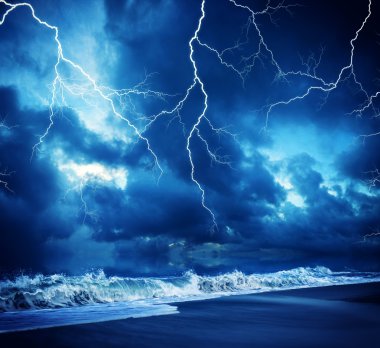 Lightning flashes across the beach durring the storm clipart