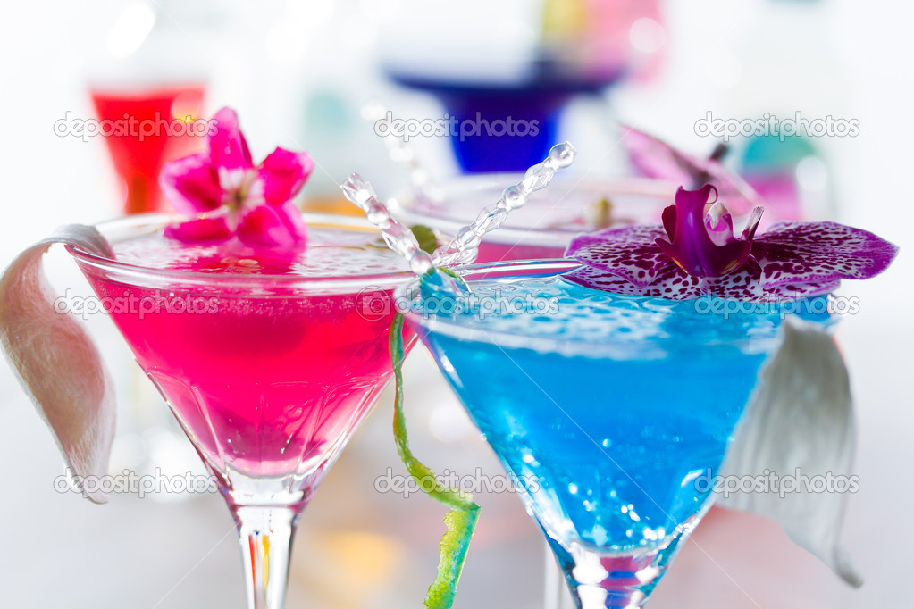 Blue swimming pool Cocktail with caviar and flower petals