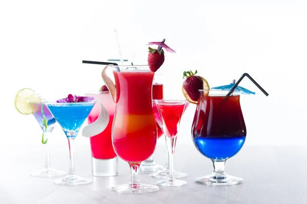 Fresh tropical layered cocktails over white — Stock Photo, Image