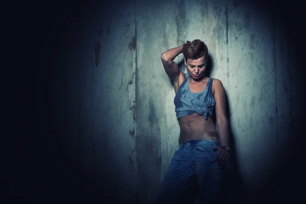 Woman on concrete Wall Background. — Stock Photo, Image