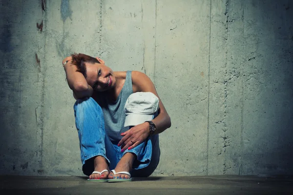 Woman on concrete Wall Background. — Stock Photo, Image