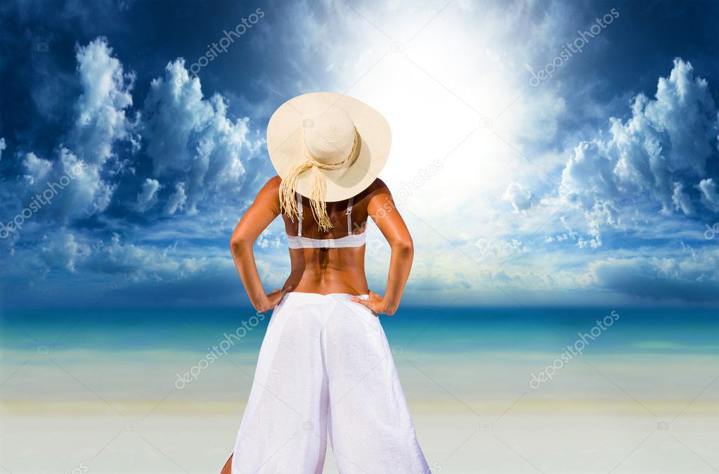 woman relaxing by the beach