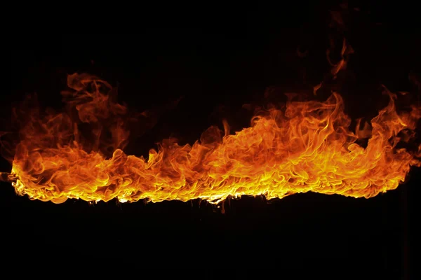 Blazing flames on black background — Stock Photo, Image