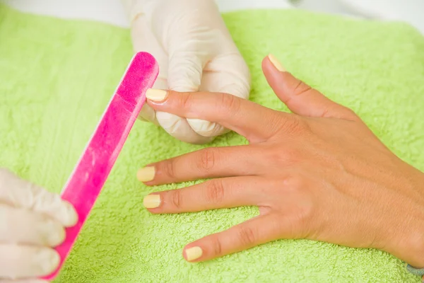 Woman getting a manicure — Stock Photo, Image