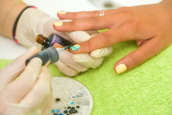 Woman getting a manicure — Stock Photo, Image