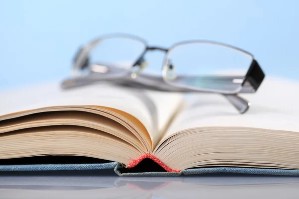 Book with eyeglasses — Stock Photo, Image