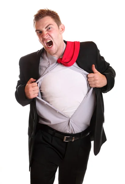 Young angry businessman tearing his shirt — Stock Photo, Image