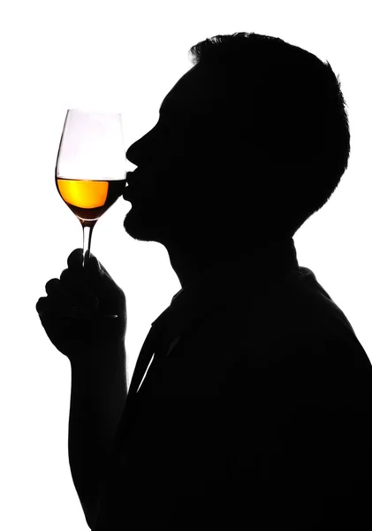 Man of silhouette giving kiss for a wine glass — Stock Photo, Image