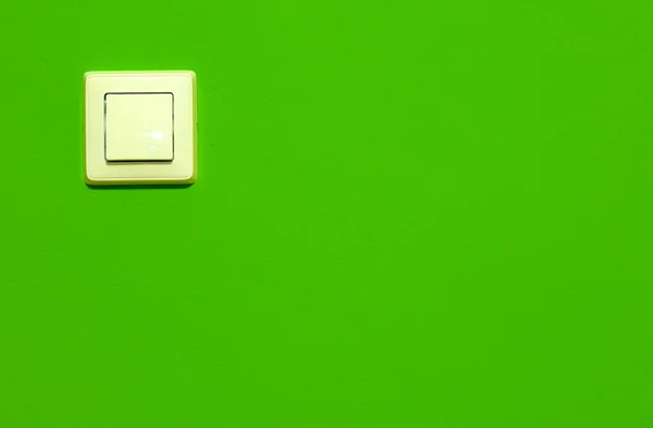 Switch on green wall — Stock Photo, Image