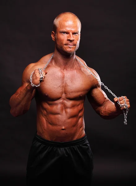 Bodybuilder with chain — Stock Photo, Image