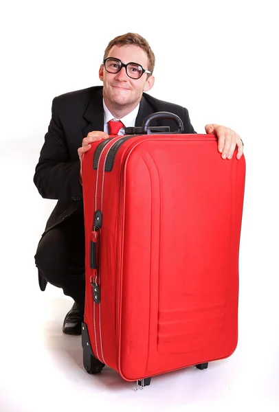 Joven hombre de negocios detrás de equipaje rojo —  Fotos de Stock