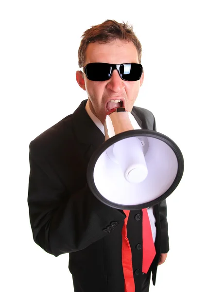 Young businessman with loudspeaker on white — Stock Photo, Image