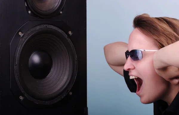 Young woman going crazy about loud music — Stock Photo, Image
