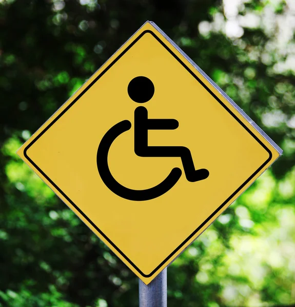 Yellow label with pictogram with wheelchair pictogram — Stock Photo, Image