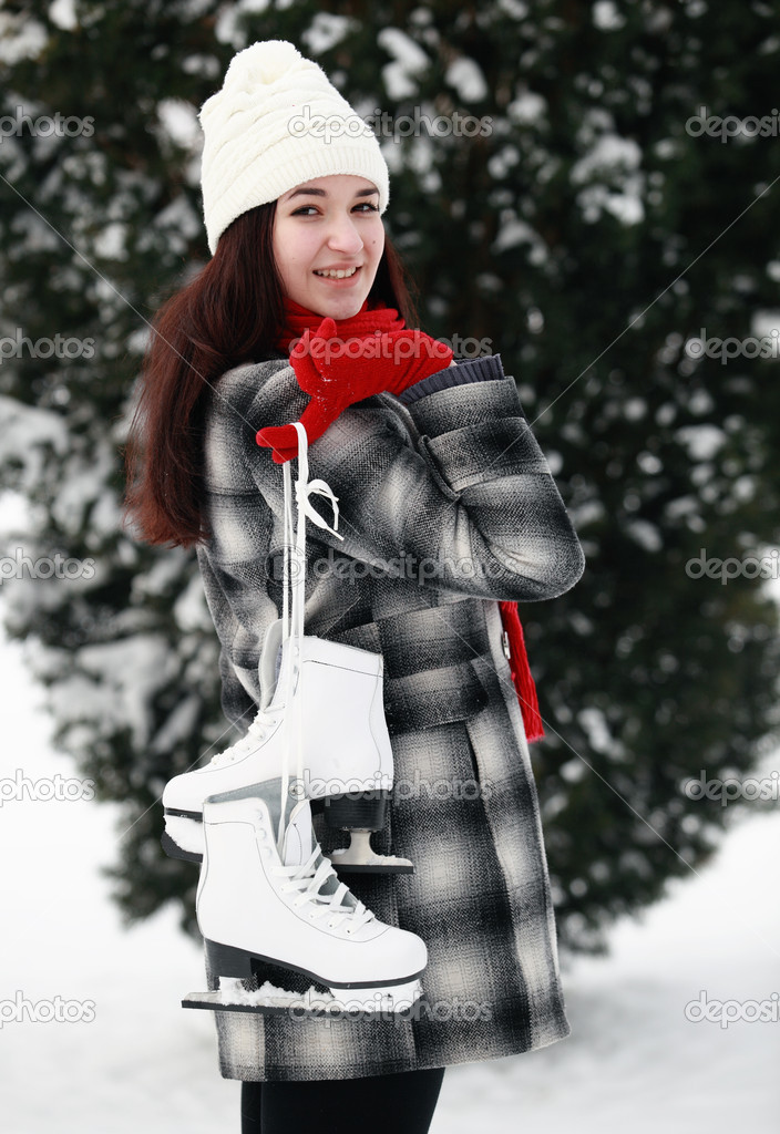 Woman holding ice skates
